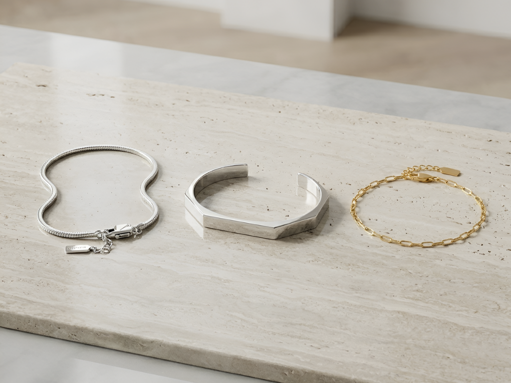 Three bracelets on a light wooden surface